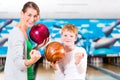 Mother and son playing together at bowling center Royalty Free Stock Photo