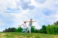 Happy Mother and son running on grass smiling Royalty Free Stock Photo