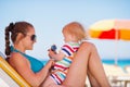 Happy mother in sunglasses playing with baby Royalty Free Stock Photo