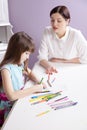 Happy mother teach her daughter to paint. Royalty Free Stock Photo