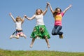 Happy Mother and two daughter jumping Royalty Free Stock Photo