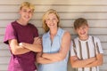 Happy Mother and Two Teenage Boys Family Outside Smiling Royalty Free Stock Photo