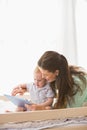 Happy mother using tablet with his baby boy Royalty Free Stock Photo