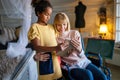 Happy mother in wheelchair with child using digital tablet at home. People family happiness concept. Royalty Free Stock Photo