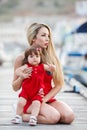 Happy mother with a young daughter near Yacht Club Royalty Free Stock Photo