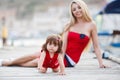 Happy mother with a young daughter near Yacht Club Royalty Free Stock Photo