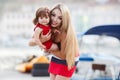 Happy mother with a young daughter near Yacht Club Royalty Free Stock Photo