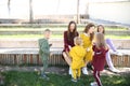 Happy mothers with children in fashionable sportswear in family style