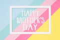 Happy Mothers Day abstract geometrical pastel blue, pink and yellow paper flat lay background. Minimalism greeting card.