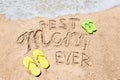 Happy Mothers day beach background with handwritten lettering Best Mom ever Royalty Free Stock Photo