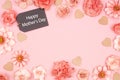 Happy Mothers Day chalkboard gift tag with frame of pink paper flowers over a pink background