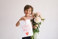 Happy Mothers Day. Cheerful happy child with Peonys bouquet.