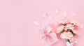 Happy mothers day composition. Pink carnation flowers , gift and paper hearts on pastel background top view Royalty Free Stock Photo