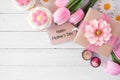 Happy Mothers Day corner border against a white wood background Royalty Free Stock Photo