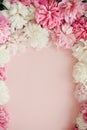 Happy mothers day floral greeting card mockup. Stylish peonies flat lay. Pink and white peonies frame on pastel pink paper with Royalty Free Stock Photo