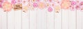 Happy Mothers Day gift tag with top border of pink paper flowers over a white wood banner background Royalty Free Stock Photo