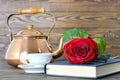 Happy Mothers Day: Red rose, book and cup of tea Royalty Free Stock Photo