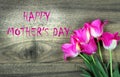 Happy Mothers Day. Tulips on a wooden table Royalty Free Stock Photo