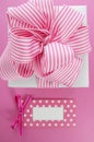 Happy Mothers Day white gift box with pink stripe ribbon. Royalty Free Stock Photo