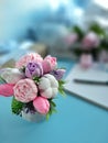 Bouquet of soap flowers on blue blurred background. Royalty Free Stock Photo