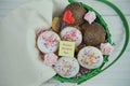 Happy mothers day words on a note in a basket of homemade cakes and fresh flowers Royalty Free Stock Photo