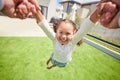 Happy, motion and child spinning on arms of parent in backyard garden for childhood, fun and bonding. Family, happiness