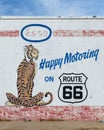 Happy Motoring mural on Route 66 gas station