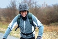 Happy mountain biker laughing in the rain