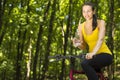 Happy mountain forest cyclist woman outdoors