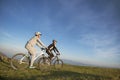 Happy mountainbike couple outdoors have fun together on a summer afternoon Royalty Free Stock Photo