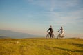 Happy mountainbike couple outdoors have fun together on a summer afternoon sunset Royalty Free Stock Photo