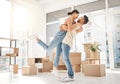 Happy, moving and hug with couple in new home for celebration, property and relocation. Excited, love and real estate