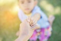 Happy mulatto boy child is smiling enjoying adopted life. Portrait of young boy in nature, park or outdoors. Concept of happy