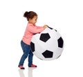 Happy mulatto little baby girl playing with ball Royalty Free Stock Photo