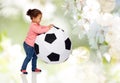 Happy mulatto little baby girl playing with ball Royalty Free Stock Photo