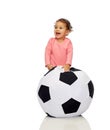 Happy mulatto little baby girl playing with ball Royalty Free Stock Photo