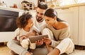 Happy multi ethnic family: parents and son using tablet  at home Royalty Free Stock Photo