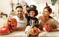 Happy multi ethnic family preparing for Halloween celebration