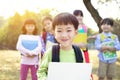 Multi-ethnic group of schoolchildren in park