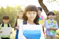 Multi-ethnic group of schoolchildren in park