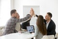 Happy multi-ethnic team giving high-five together promising loya Royalty Free Stock Photo