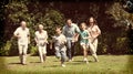 Happy multi generation family running towards camera Royalty Free Stock Photo