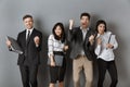 happy multicultural business people with folders and notebooks standing