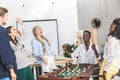 happy multicultural colleagues celebration win while playing table football Royalty Free Stock Photo