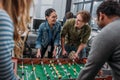 happy multicultural people playing in table soccer Royalty Free Stock Photo