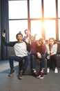 Happy multicultural teenagers playing video games with joysticks at home Royalty Free Stock Photo