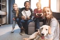 Happy multicultural teenagers playing video games with joysticks at home Royalty Free Stock Photo