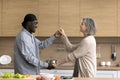 Happy multiethnic couple dancing in the kitchen Royalty Free Stock Photo