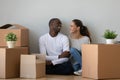 Happy multiethnic couple moving to new home together Royalty Free Stock Photo
