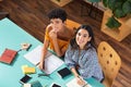 Happy multiethnic girl studying together